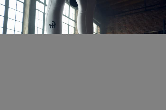 Side view of Patrick Mahomes' white and red adidas shoes.